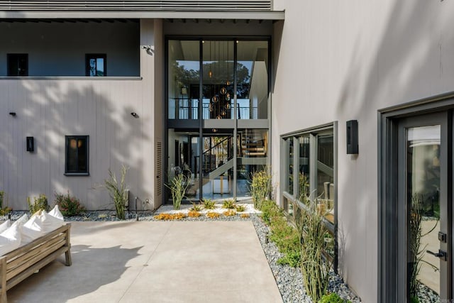 property entrance with a patio area