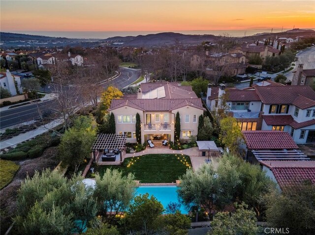 bird's eye view featuring a mountain view and a residential view