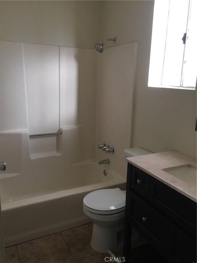 full bathroom with bathtub / shower combination, vanity, toilet, and tile patterned floors