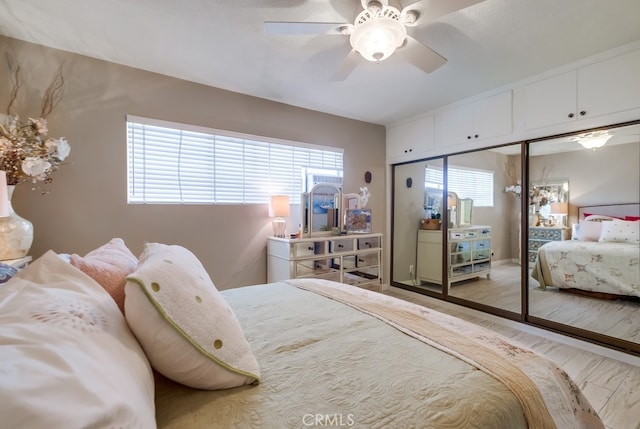bedroom with a ceiling fan and a closet