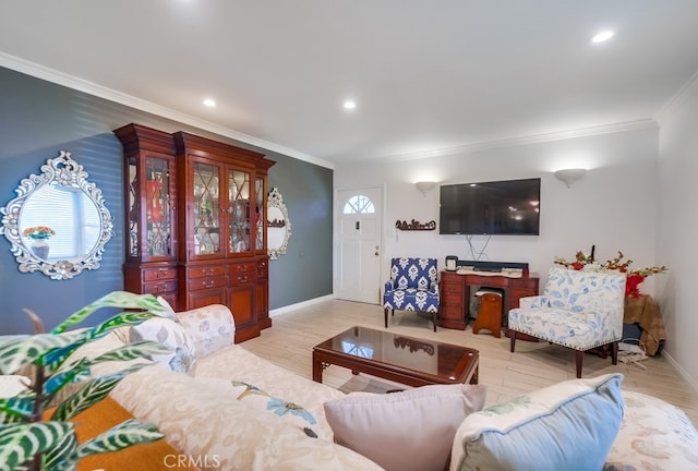 living area featuring ornamental molding, recessed lighting, light wood-style floors, and baseboards