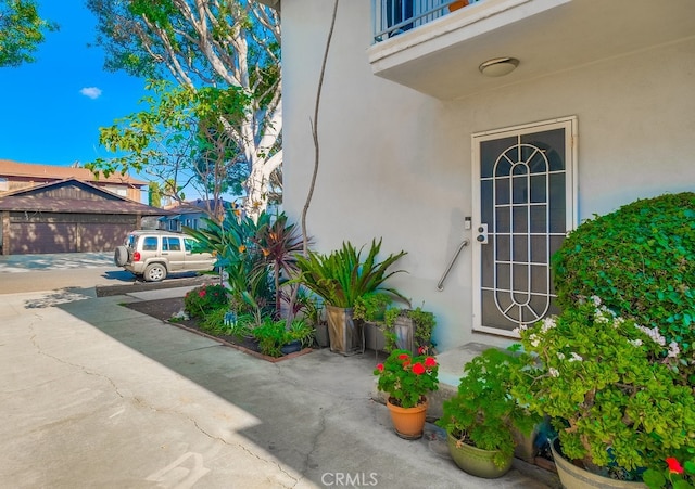 doorway to property with stucco siding