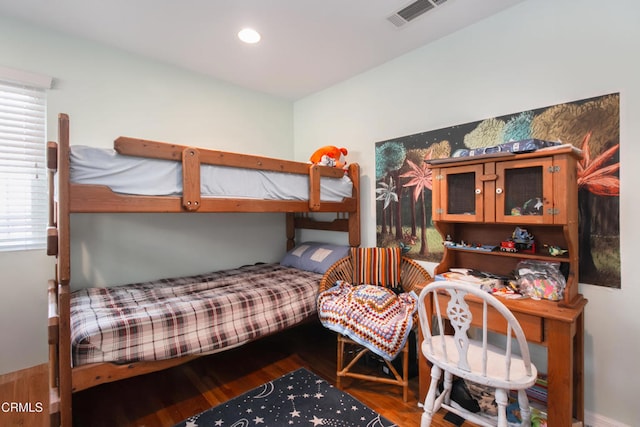 bedroom with recessed lighting, visible vents, and wood finished floors