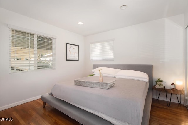 bedroom with multiple windows, baseboards, dark wood-style flooring, and recessed lighting