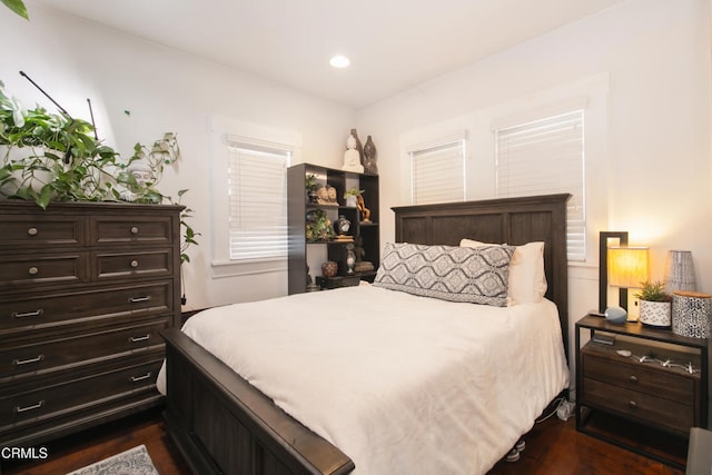 bedroom featuring dark wood-style floors and recessed lighting