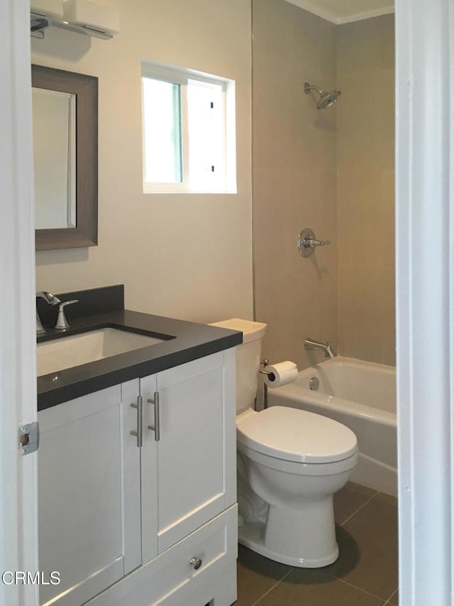 bathroom with toilet, bathing tub / shower combination, vanity, and tile patterned floors