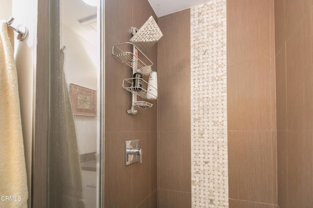 bathroom with a tile shower