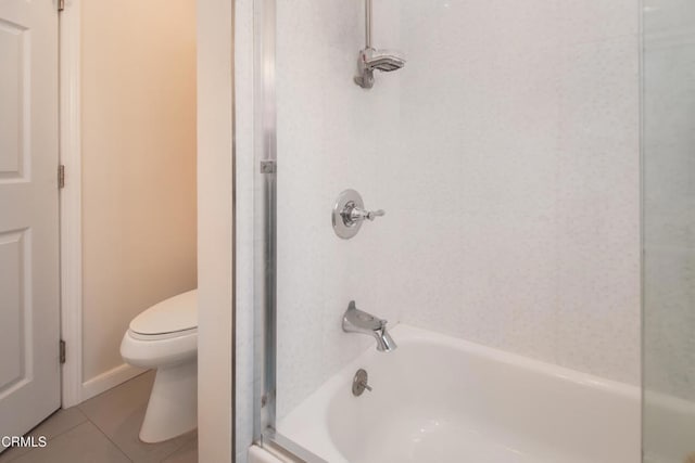 full bath featuring toilet, tile patterned flooring, and shower / tub combination