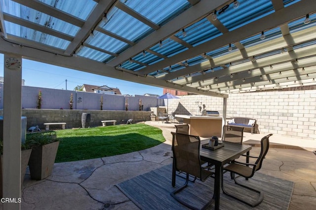 view of patio featuring a fenced backyard, outdoor dining area, and a pergola