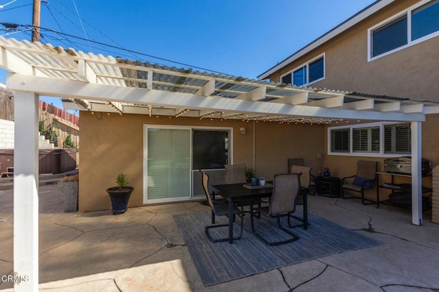 view of patio with outdoor dining area and a pergola