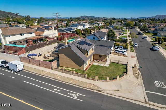 drone / aerial view featuring a residential view and a mountain view