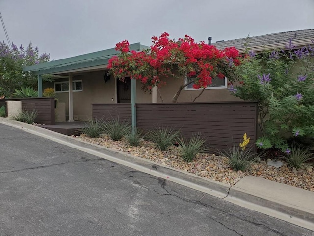 view of side of home with stucco siding