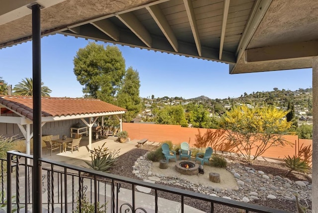 exterior space featuring a fenced backyard, an outdoor fire pit, and a patio