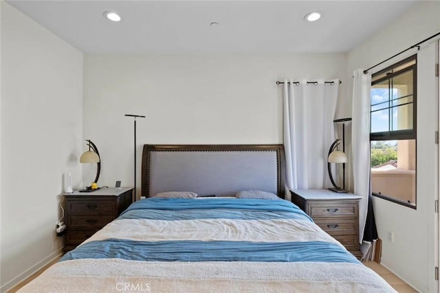 bedroom featuring recessed lighting and baseboards