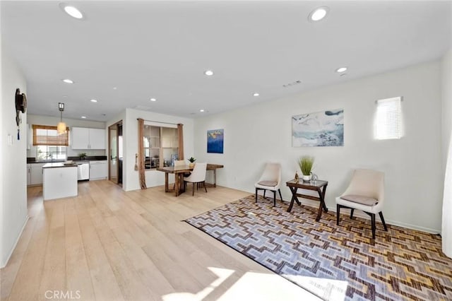 interior space featuring light wood-type flooring, visible vents, and recessed lighting