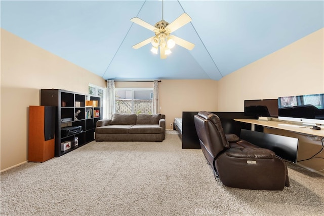 carpeted office space with ceiling fan, high vaulted ceiling, and baseboards