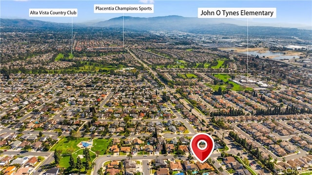 birds eye view of property featuring a residential view and a mountain view