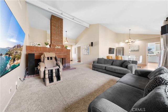 living room with light colored carpet, a notable chandelier, a fireplace, baseboards, and beamed ceiling