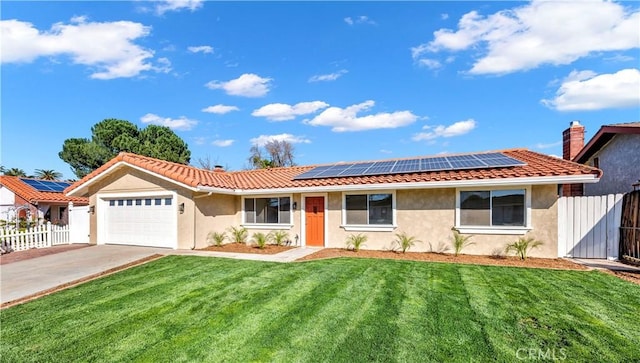 ranch-style house with an attached garage, solar panels, fence, stucco siding, and a front lawn