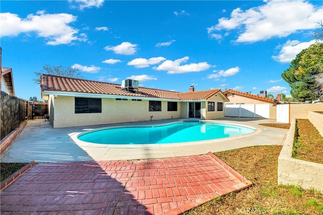 view of pool featuring a patio, a fenced backyard, and a fenced in pool