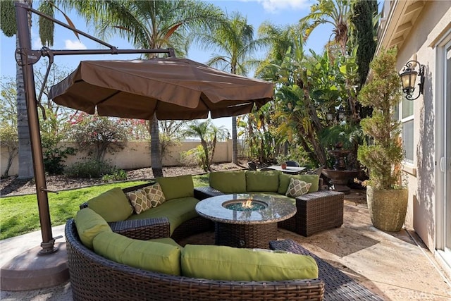 view of patio / terrace with outdoor lounge area and fence