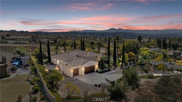 birds eye view of property with a mountain view