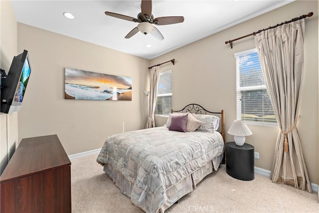 bedroom with recessed lighting, light carpet, ceiling fan, and baseboards