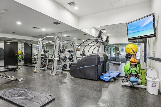 gym featuring recessed lighting and visible vents