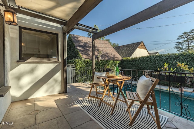 balcony with a patio and outdoor dining space