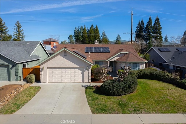 single story home featuring driveway, an attached garage, fence, a front lawn, and stucco siding