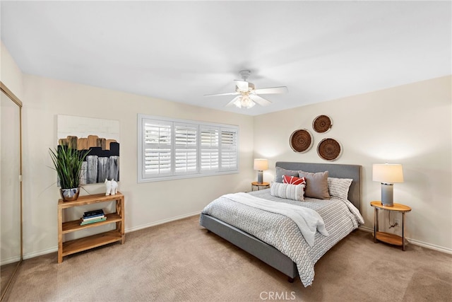 bedroom with light carpet and baseboards