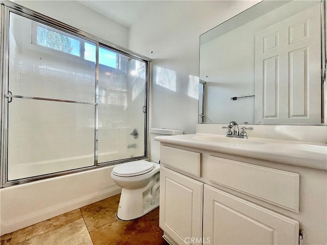 bathroom with enclosed tub / shower combo, toilet, tile patterned flooring, and vanity