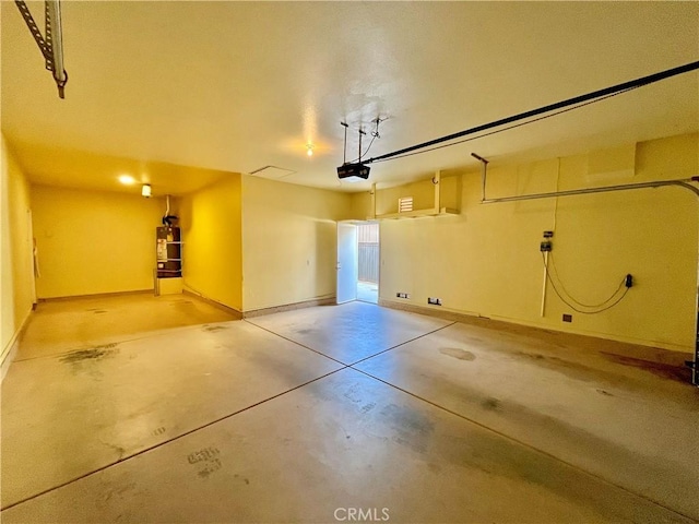 garage featuring baseboards and a garage door opener