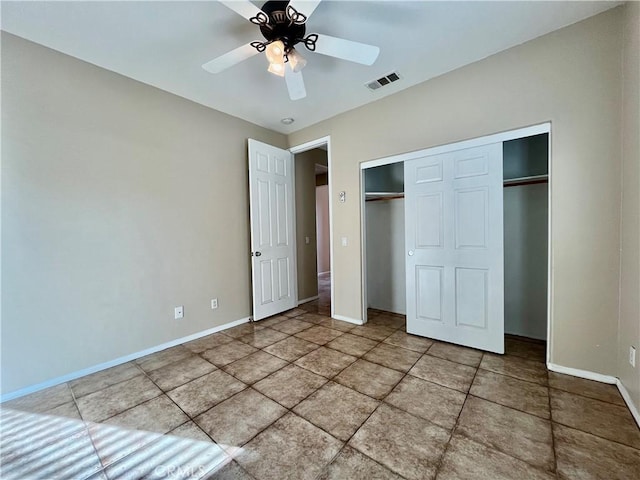 unfurnished bedroom featuring a ceiling fan, baseboards, visible vents, and a closet