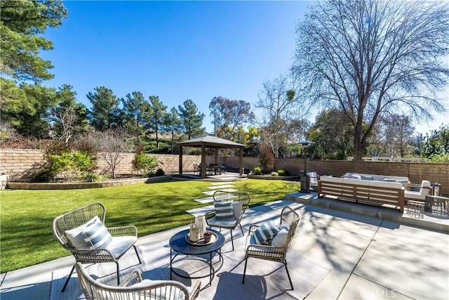 view of patio / terrace featuring an outdoor hangout area, a gazebo, and a fenced backyard