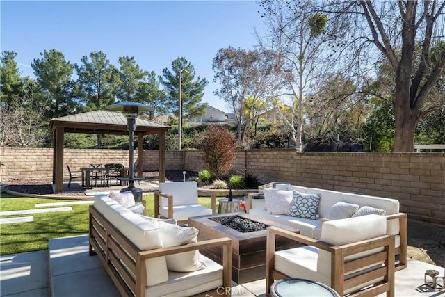 view of patio featuring a gazebo, a fenced backyard, and an outdoor living space with a fire pit