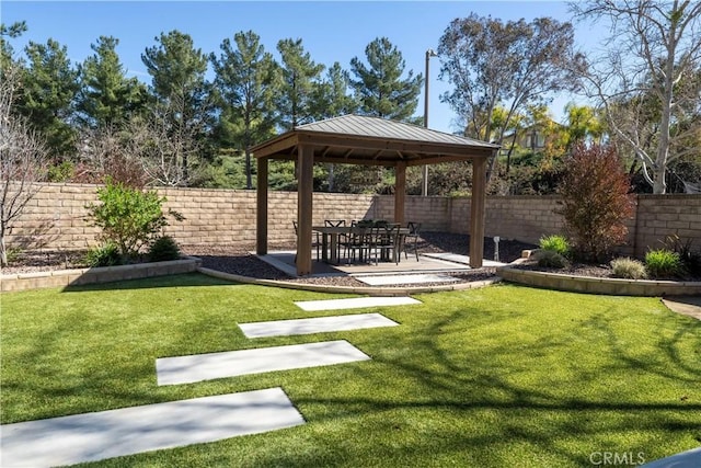 view of yard with a patio area, a fenced backyard, and a gazebo