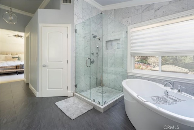 ensuite bathroom with ensuite bathroom, ceiling fan, ornamental molding, a soaking tub, and a shower stall