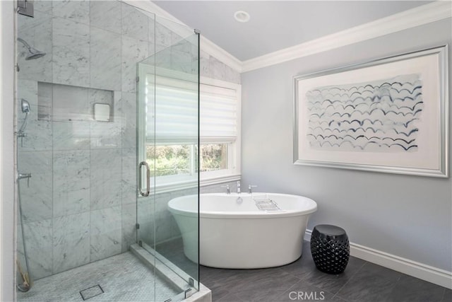 full bathroom with a soaking tub, a shower stall, baseboards, and crown molding