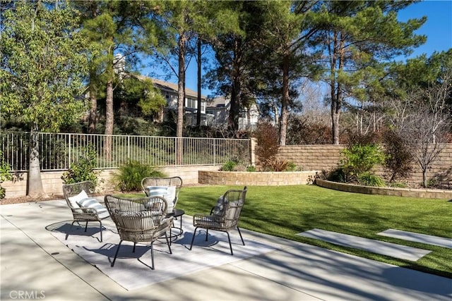 view of patio featuring fence