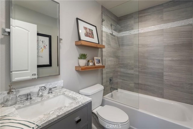 bathroom with shower / bathing tub combination, vanity, and toilet