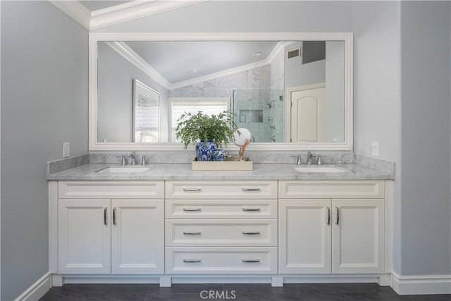 full bathroom featuring lofted ceiling, a marble finish shower, visible vents, and a sink