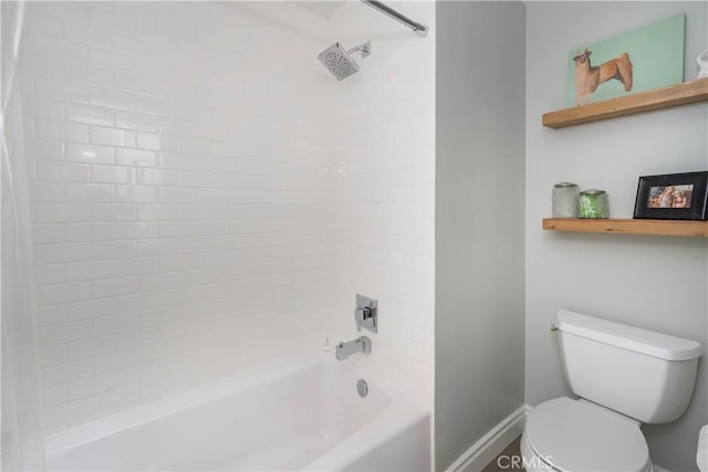 full bath with tub / shower combination, toilet, and baseboards