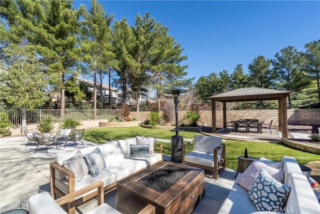 view of patio / terrace with a fenced backyard, an outdoor living space, and a gazebo