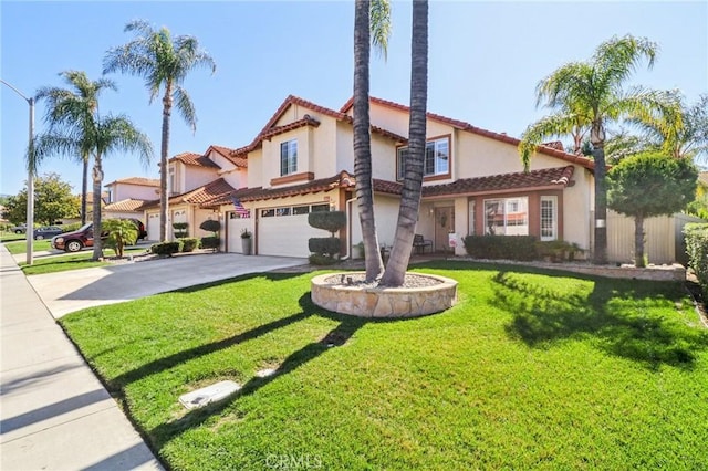 mediterranean / spanish-style home featuring an attached garage, a front lawn, concrete driveway, and stucco siding