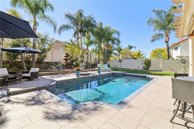 view of pool featuring a fenced backyard, a fenced in pool, and a patio