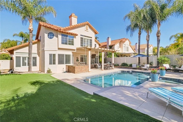 rear view of property with a fenced in pool, a chimney, stucco siding, a pergola, and fence private yard