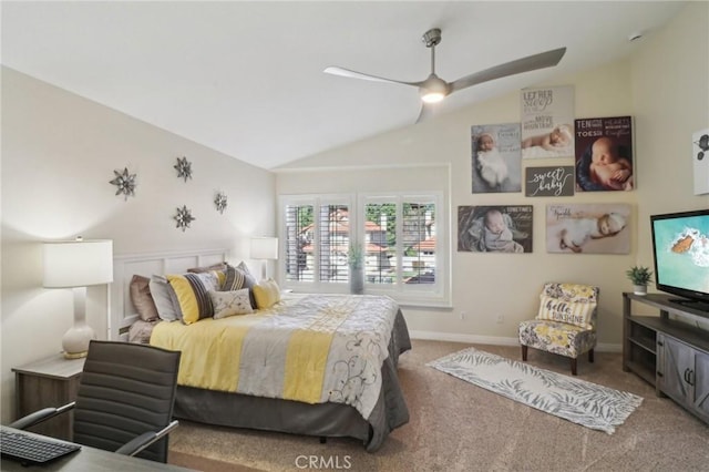 carpeted bedroom with ceiling fan, baseboards, and vaulted ceiling