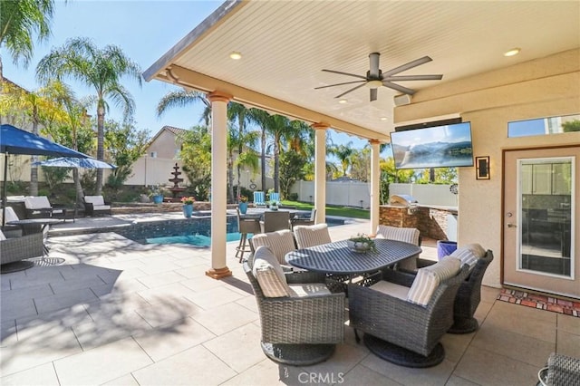 view of patio / terrace with outdoor dining space, area for grilling, a fenced backyard, and a ceiling fan