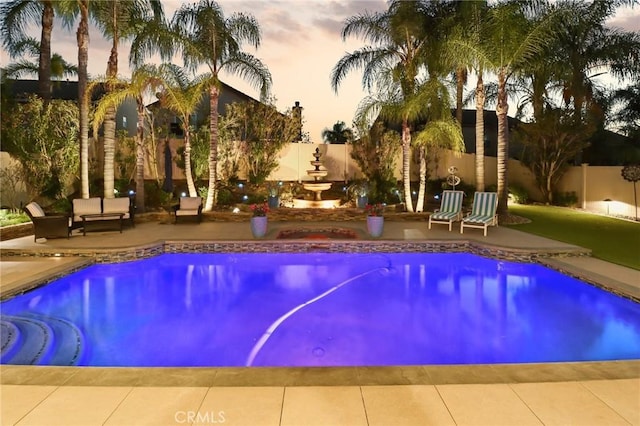 view of pool featuring a patio area, a fenced backyard, and a fenced in pool